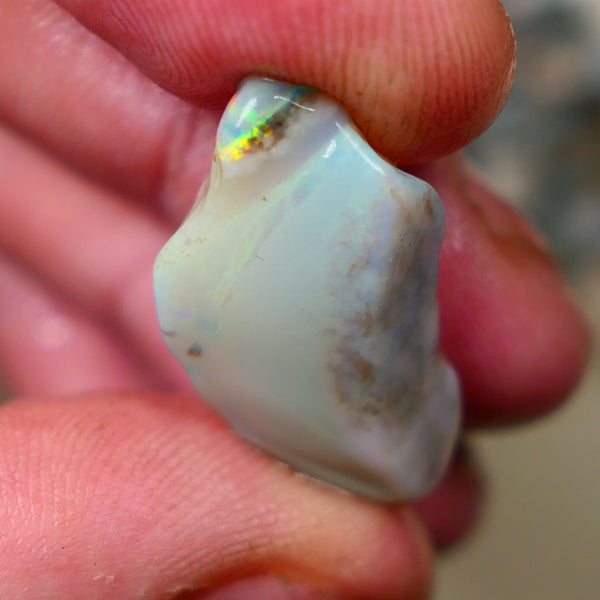 Lightning Ridge opal with interesting bit of bar 11.00cts Multicolours on Black base 24x15x5mm B4-A167