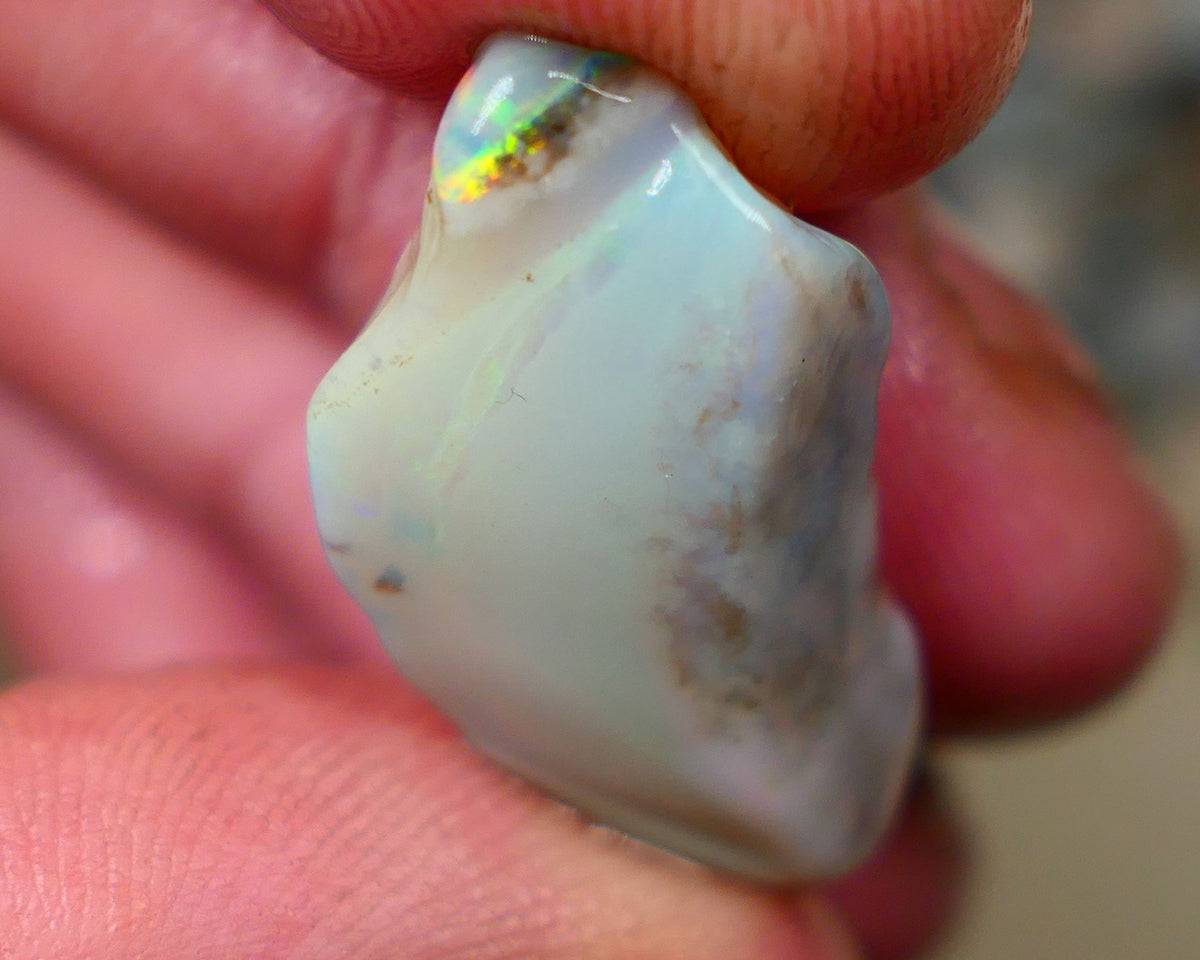 Lightning Ridge opal with interesting bit of bar 11.00cts Multicolours on Black base 24x15x5mm B4-A167