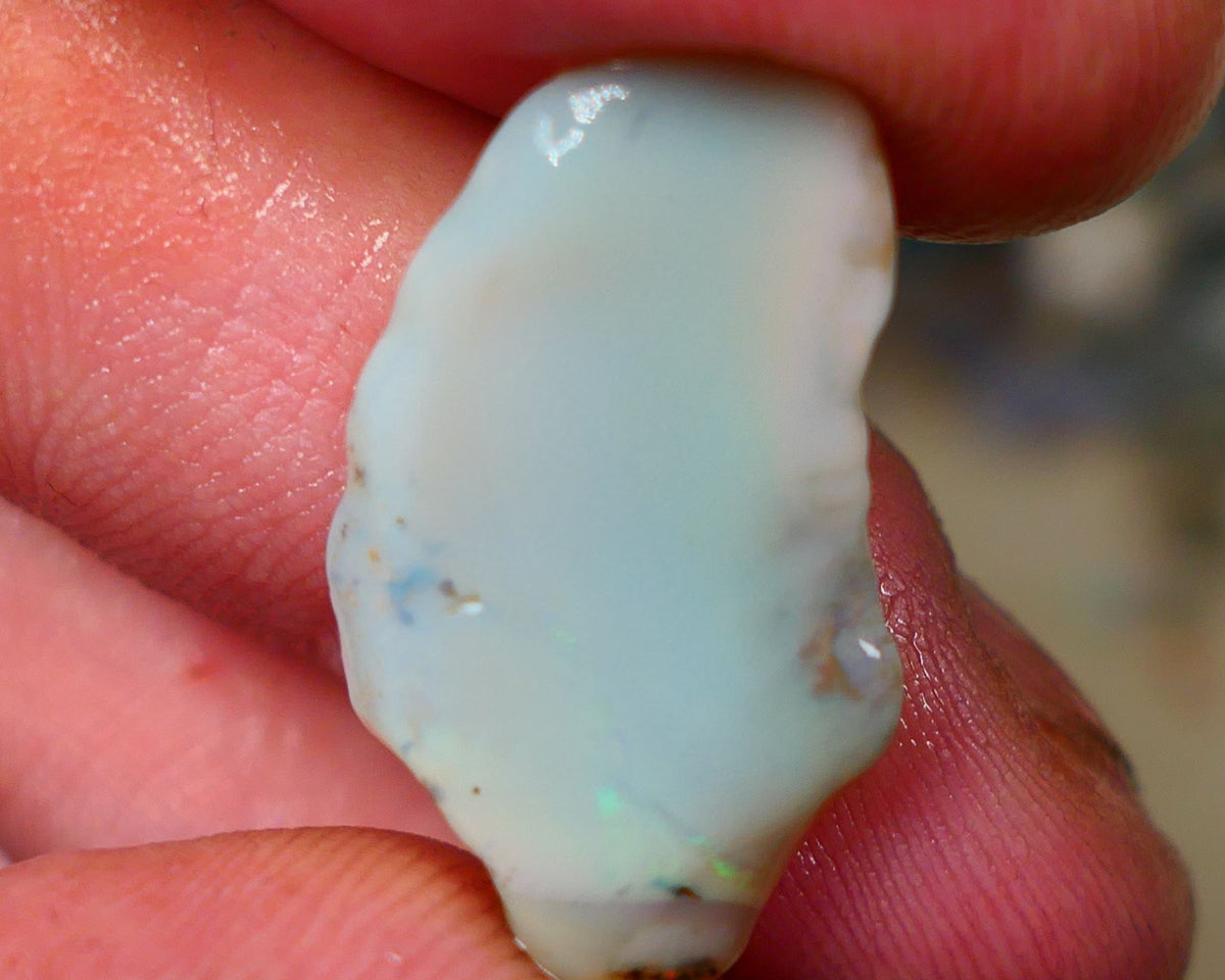 Lightning Ridge opal with interesting bit of bar 11.00cts Multicolours on Black base 24x15x5mm B4-A167