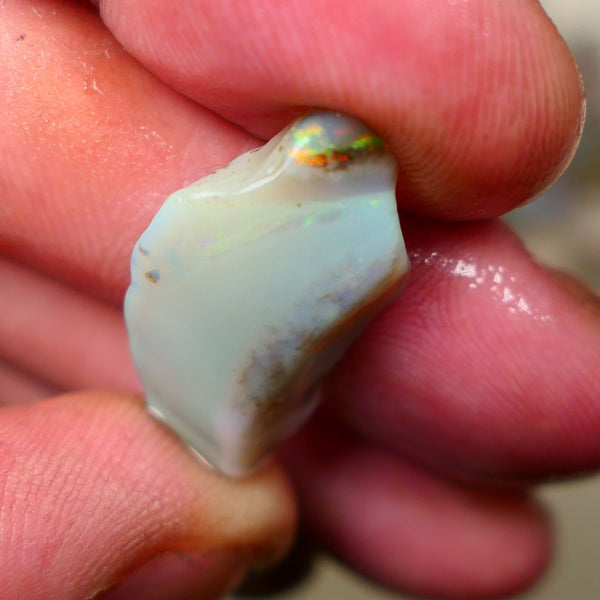 Lightning Ridge opal with interesting bit of bar 11.00cts Multicolours on Black base 24x15x5mm B4-A167