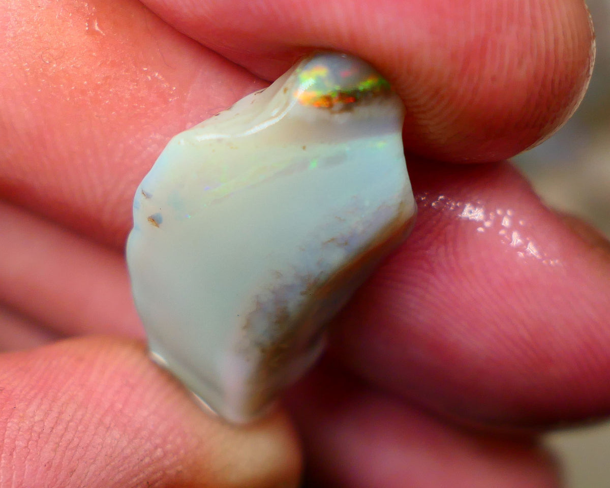 Lightning Ridge opal with interesting bit of bar 11.00cts Multicolours on Black base 24x15x5mm B4-A167