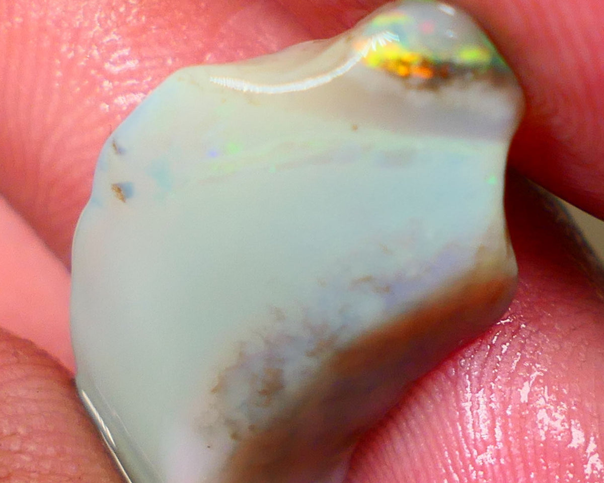 Lightning Ridge opal with interesting bit of bar 11.00cts Multicolours on Black base 24x15x5mm B4-A167