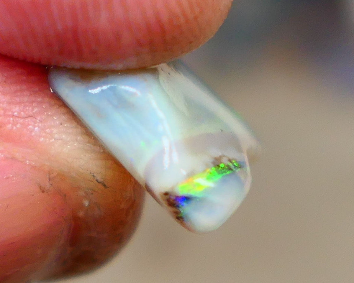 Lightning Ridge opal with interesting bit of bar 11.00cts Multicolours on Black base 24x15x5mm B4-A167