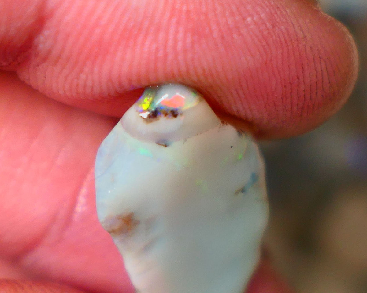 Lightning Ridge opal with interesting bit of bar 11.00cts Multicolours on Black base 24x15x5mm B4-A167