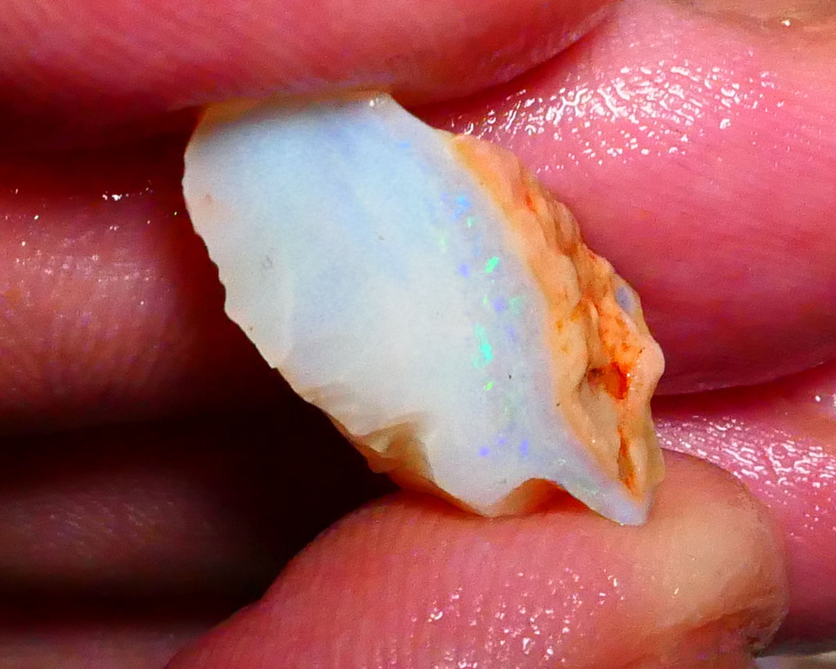 Coober Pedy Seam opal 8.00cts Thin bar with light tones of greens & blues to gamble 22x10x8mm Lot B4-A423