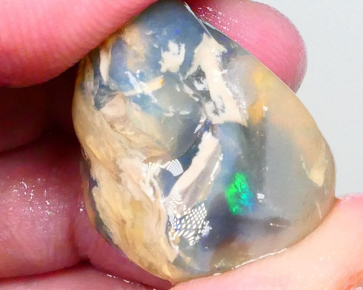 Big Sized Dark base Lightning Ridge Knobby opal rough 58.00cts Green Fires flashes in the exposed bar to chase 28x25x17mm  Lot B4-A438