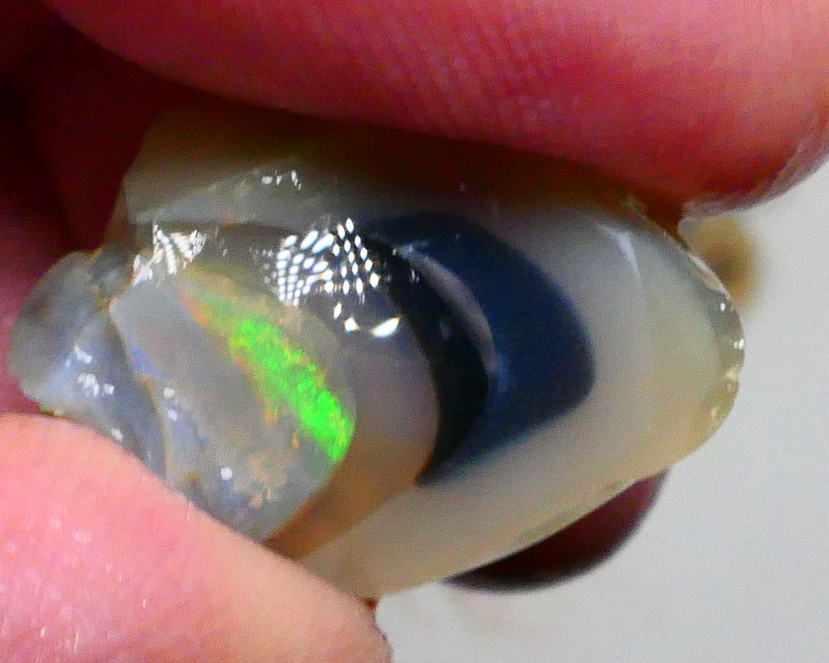 Green dominant Multifires exposed in the bars of this 41.50cts Dark Crystal knobby opal split of Lightning Ridge 22x14x13mm & 18x15x14mm  Lot B4-A458