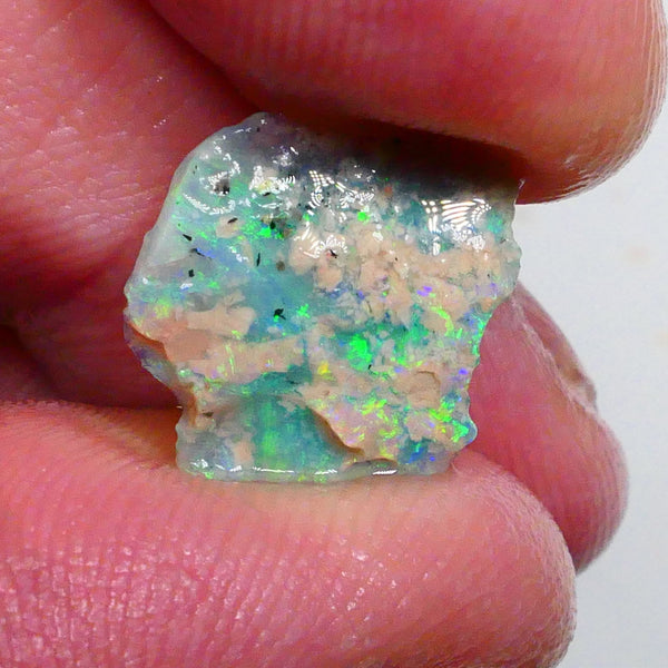 Thin profile knobby opal rough 2.50cts Dark base with Yellow/Green/Blue fires inclusions to work around 13x12x3mm Lot B4-A469