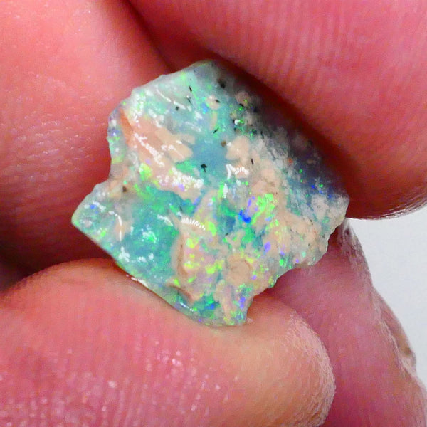 Thin profile knobby opal rough 2.50cts Dark base with Yellow/Green/Blue fires inclusions to work around 13x12x3mm Lot B4-A469