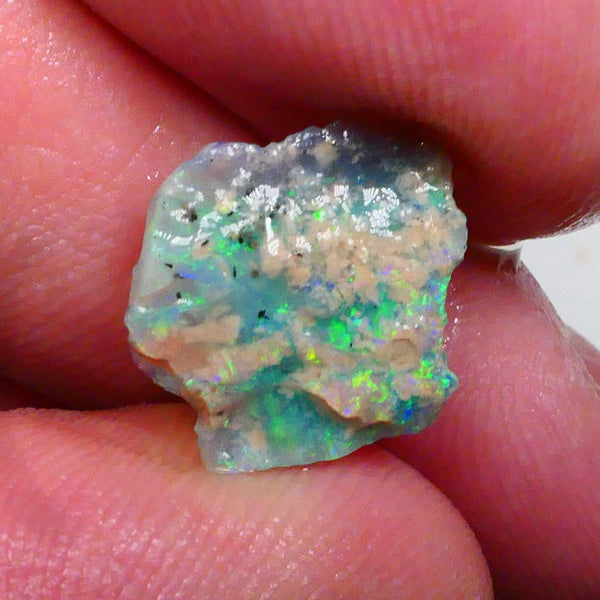 Thin profile knobby opal rough 2.50cts Dark base with Yellow/Green/Blue fires inclusions to work around 13x12x3mm Lot B4-A469