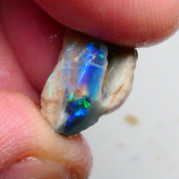 Clipped Black knobby opal rough 8.50cts Bright Green/Teal/Blue Directional fires 19x12x8mm Sold as gamble  Lot B4-A463