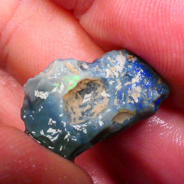 Dark Base Seam opal Rough 8.50cts One side showing lots of Blues small zone of greens on the other Lightning Ridge gamble Cut 23x14x6mm to come Lot B4-A499