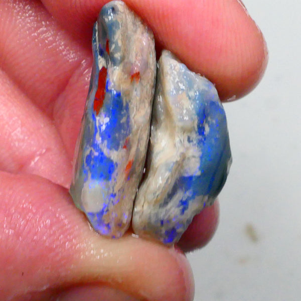 Lots of blues on this pair of Dark base knobby opal rough 24.00cts Lightning Ridge to gamble 24x12x7mm & 20x13x9mm Lot B4-A496