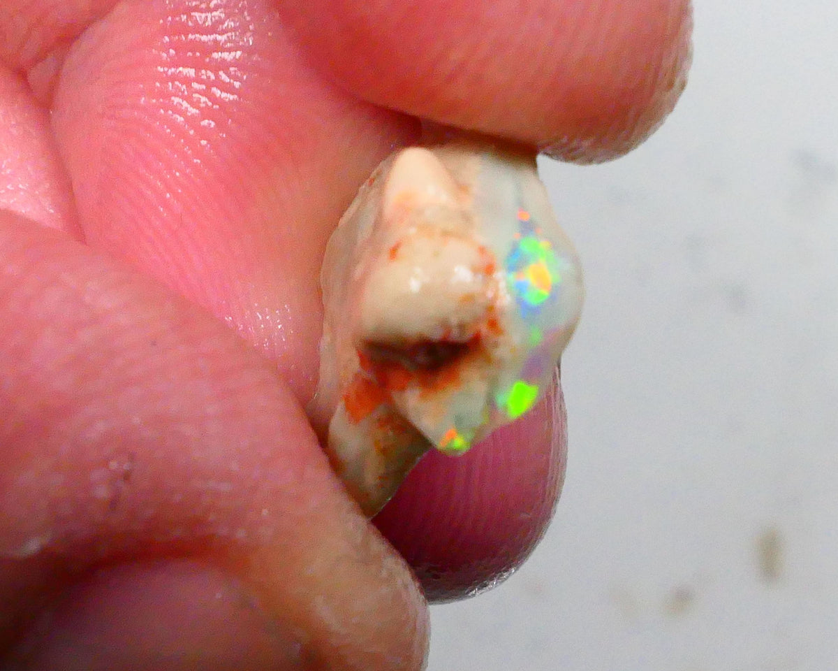 Oranges & Yellows dominant here 4.00cts Small Point to be had for those who dare Lightning Ridge 15x13x6mm Lot B4-A493