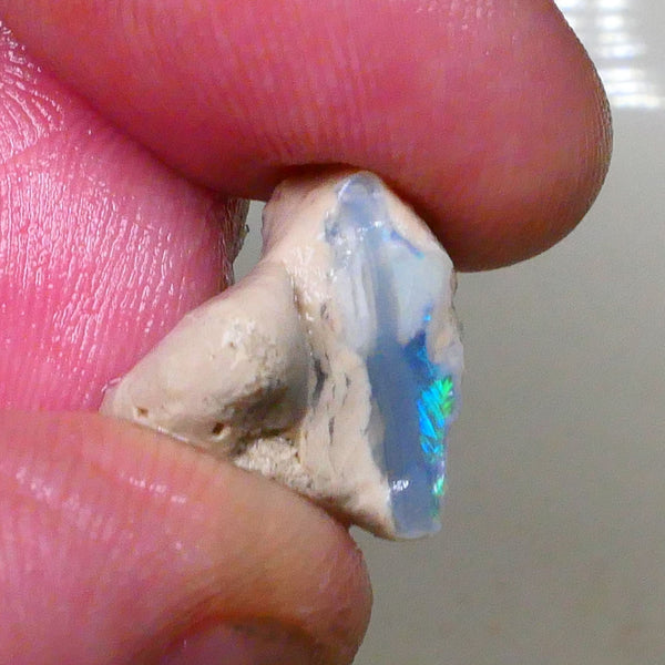 Lightning ridge Dark Base Seam opal formation with clay/sand host rock 11.00cts Bright Greens /.Blues in small bit of bar 15x15x9mm Lot B4-A511