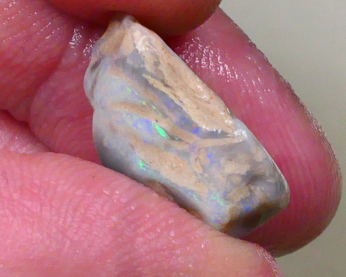 Tumbled Dark base knobby opal rough 10.50cts Stacked colour bars showing some Multifires 18x14x8mm  Lot B4-A518