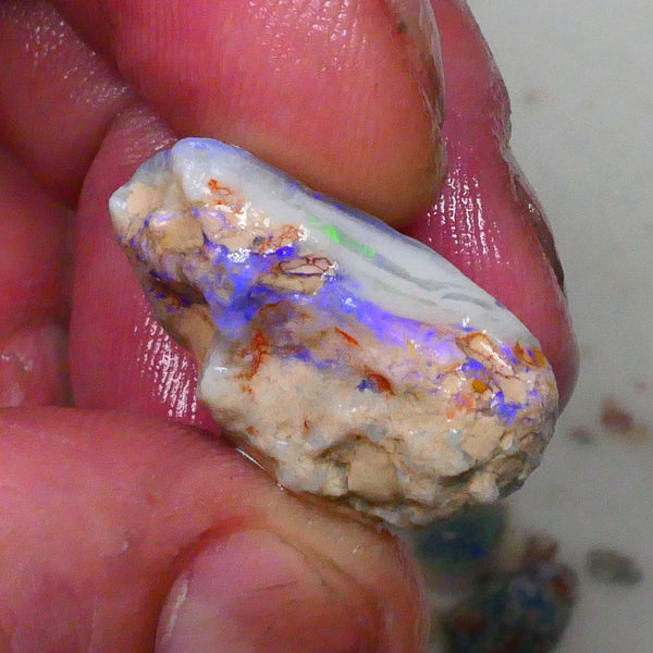 Knobby opal formation rough of Lighting Ridge 23.00cts Bright Blues in bar visible 360 but clay/sand host to work around 25x14x13mm  Lot B4-A580