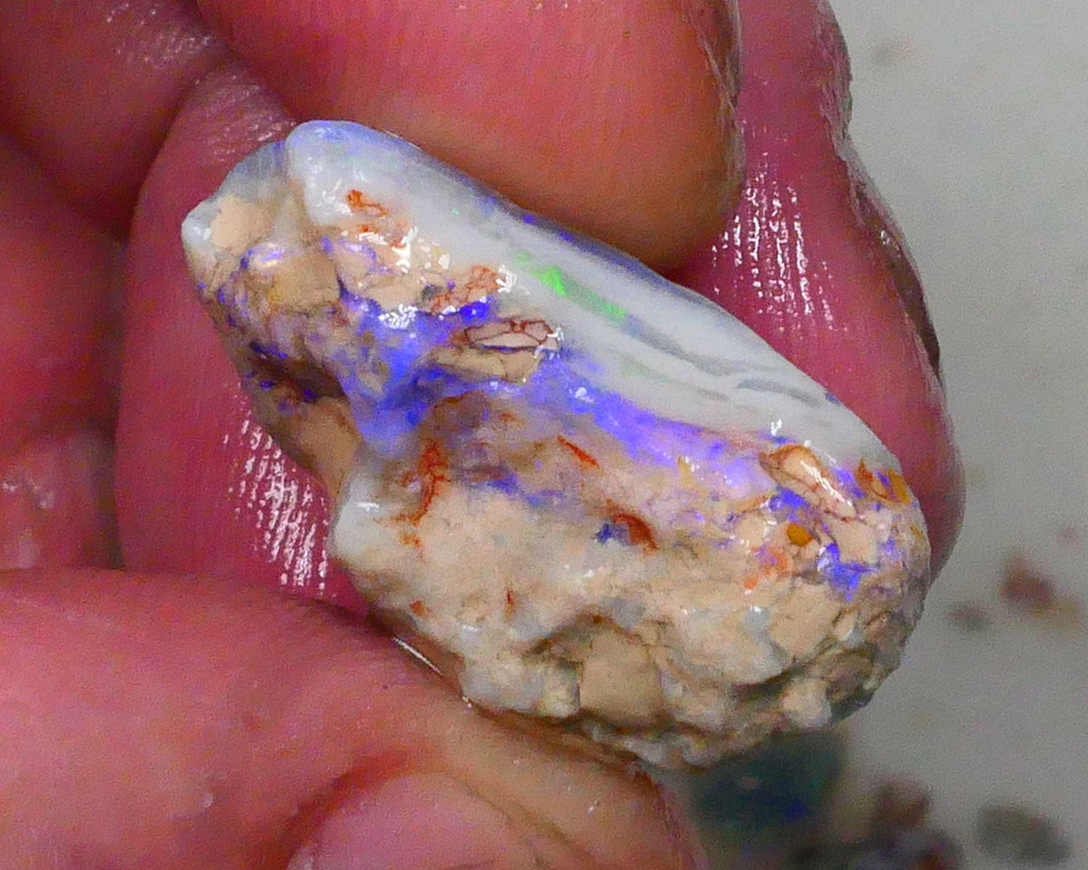 Knobby opal formation rough of Lighting Ridge 23.00cts Bright Blues in bar visible 360 but clay/sand host to work around 25x14x13mm  Lot B4-A580
