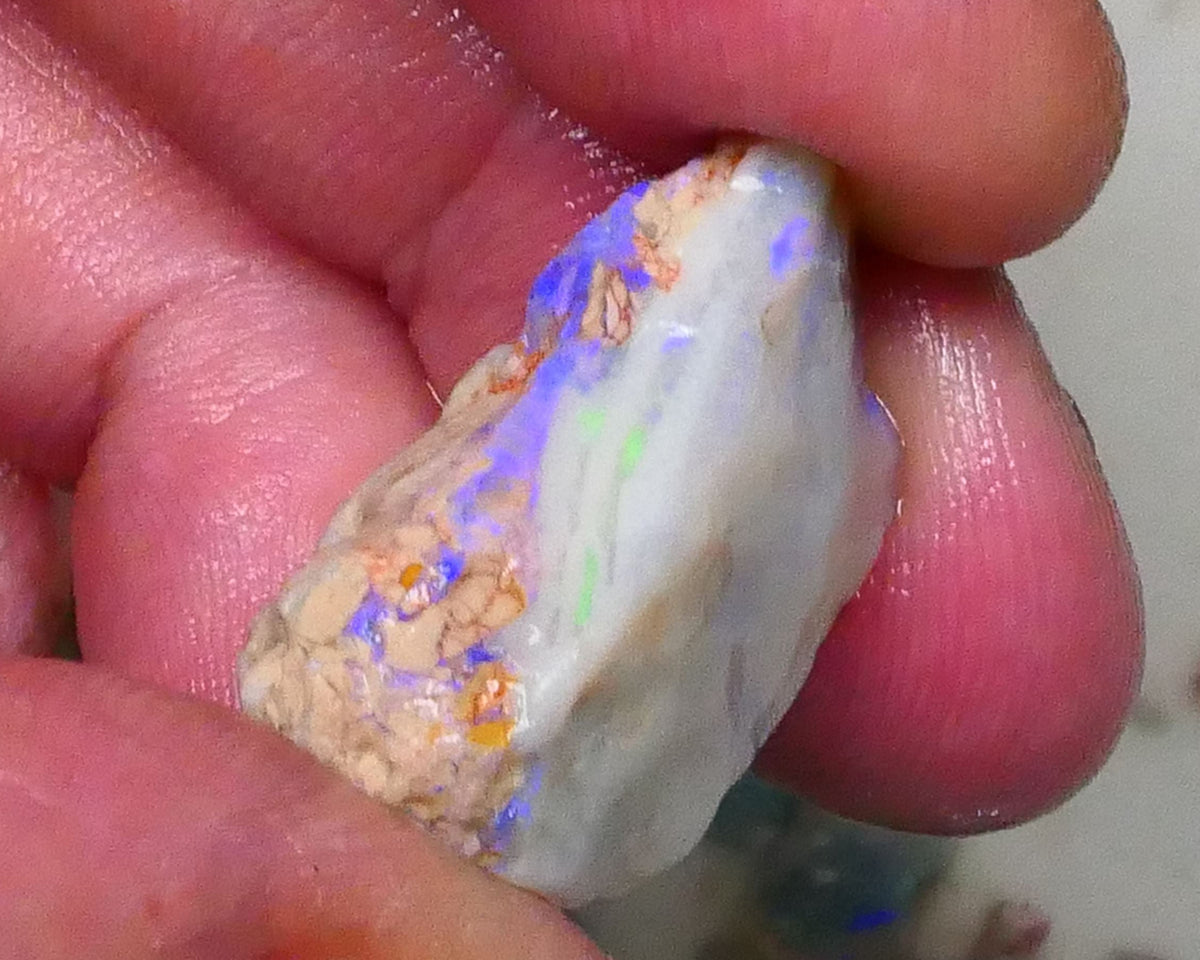 Knobby opal formation rough of Lighting Ridge 23.00cts Bright Blues in bar visible 360 but clay/sand host to work around 25x14x13mm  Lot B4-A580