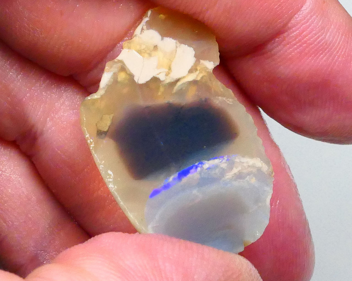 Lighting ridge Knobby opal rough slice 27.00cts  some blues fires in bar to gamble 33x23x6mm  Lot B4-A603