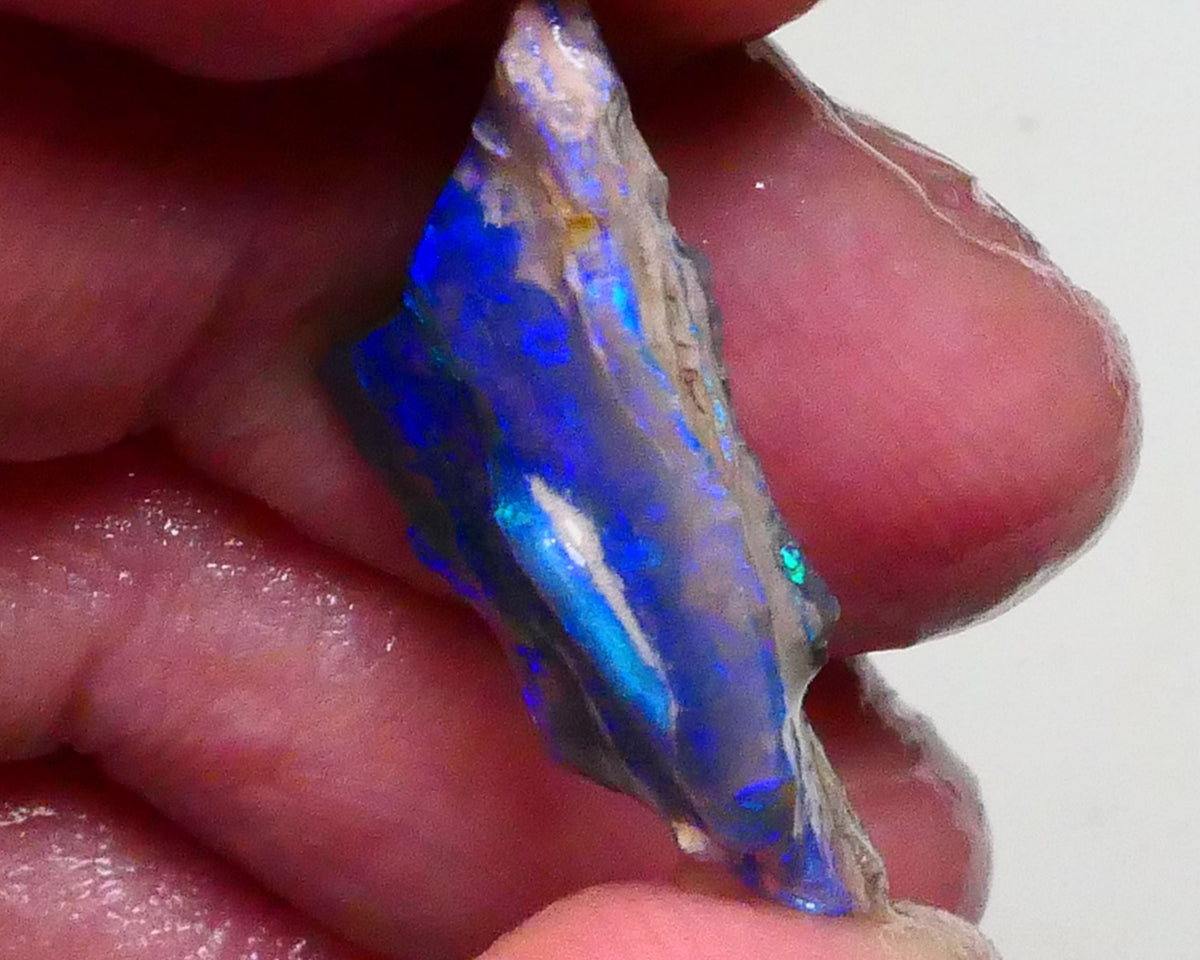 Gorgeous Bright Royal Blues on this Black seam opal rough to cut 8.60cts Lightning Ridge Material 27x18x6mm  Lot B4-A623