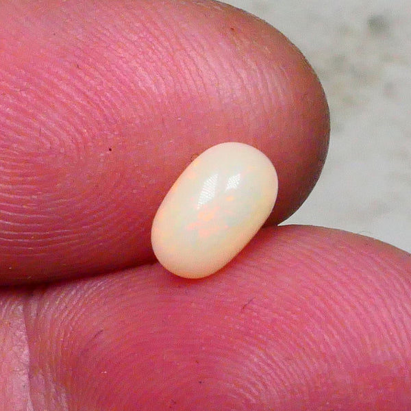 Lightning Ridge Light base polished Gemstone 1.00cts Pin Fires oranges & yellows 8x5x3.5mm ready to set Lot B4-A645