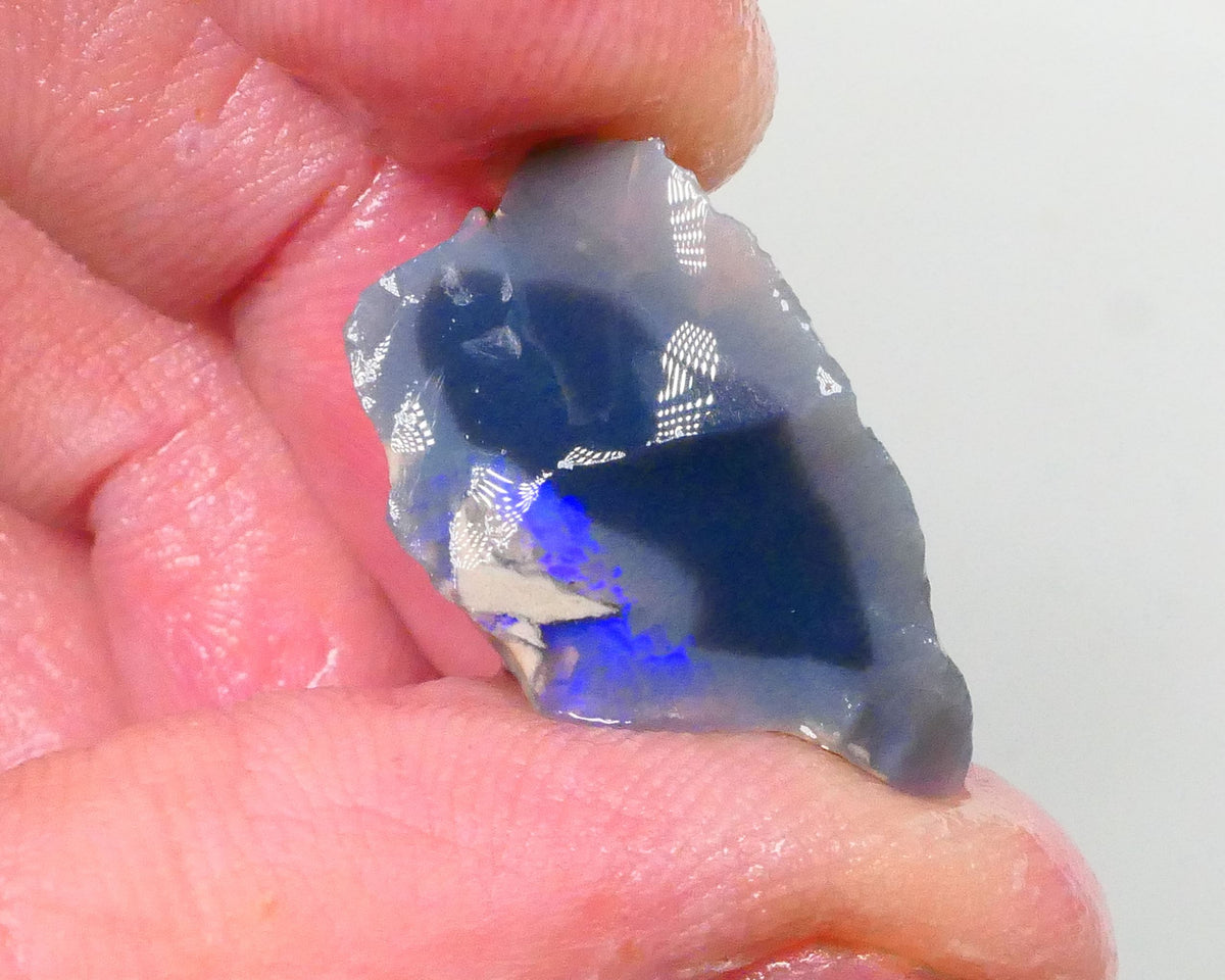 Piece of a Dark base knobby opal rough 12.35cts Lightning Ridge Zone of exposed Blue fires to gamble 23x14x10mm Lot B4-A745