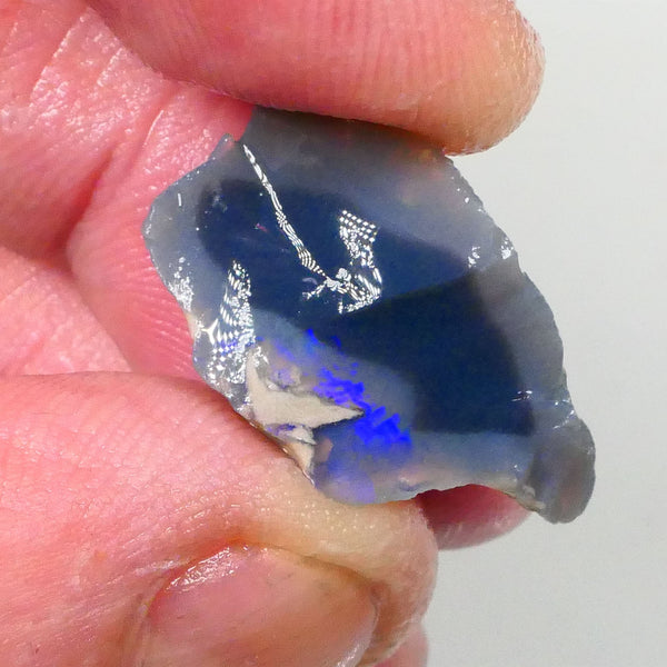 Piece of a Dark base knobby opal rough 12.35cts Lightning Ridge Zone of exposed Blue fires to gamble 23x14x10mm Lot B4-A745
