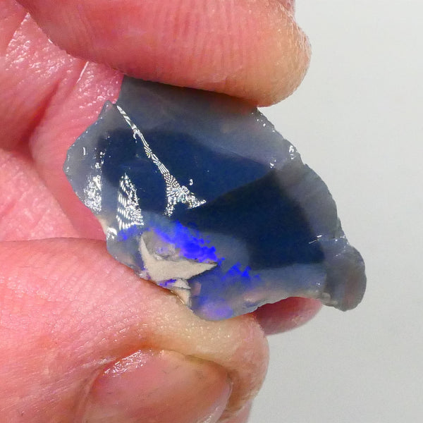 Piece of a Dark base knobby opal rough 12.35cts Lightning Ridge Zone of exposed Blue fires to gamble 23x14x10mm Lot B4-A745