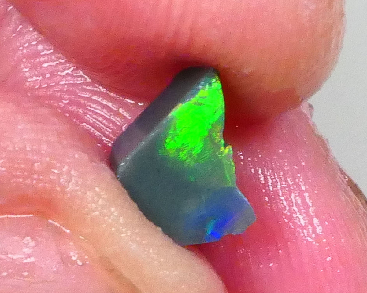 Gorgeous Broad zone of Electric Bright Green fires 1.60cts Lightning Ridge rub/rough pointer to finish 8x6x5mm   Lot B4-A736