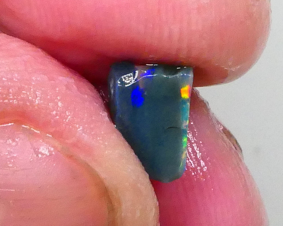 Gorgeous Broad zone of Electric Bright Green fires 1.60cts Lightning Ridge rub/rough pointer to finish 8x6x5mm   Lot B4-A736
