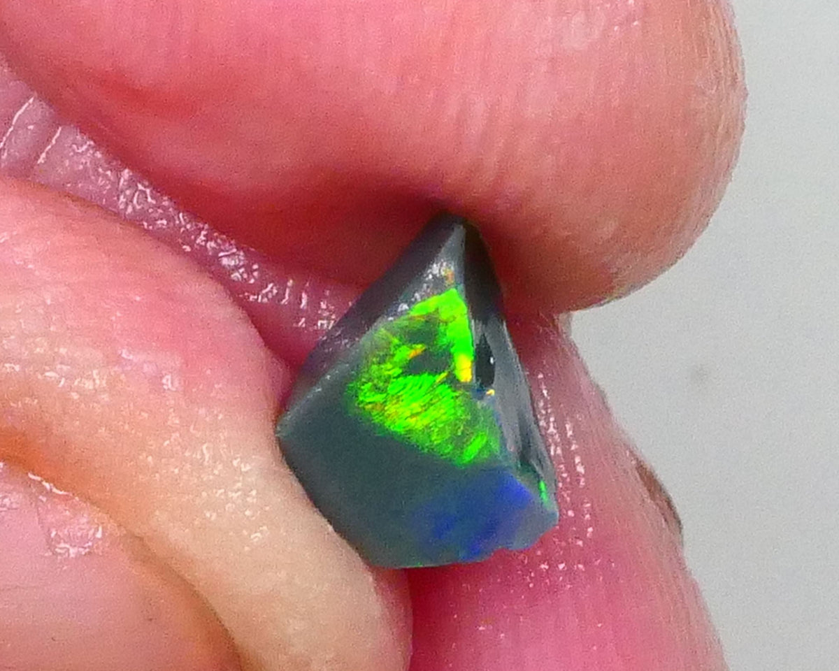 Gorgeous Broad zone of Electric Bright Green fires 1.60cts Lightning Ridge rub/rough pointer to finish 8x6x5mm   Lot B4-A736