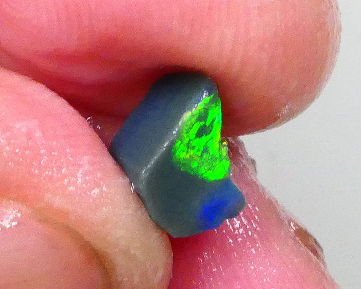 Gorgeous Broad zone of Electric Bright Green fires 1.60cts Lightning Ridge rub/rough pointer to finish 8x6x5mm   Lot B4-A736