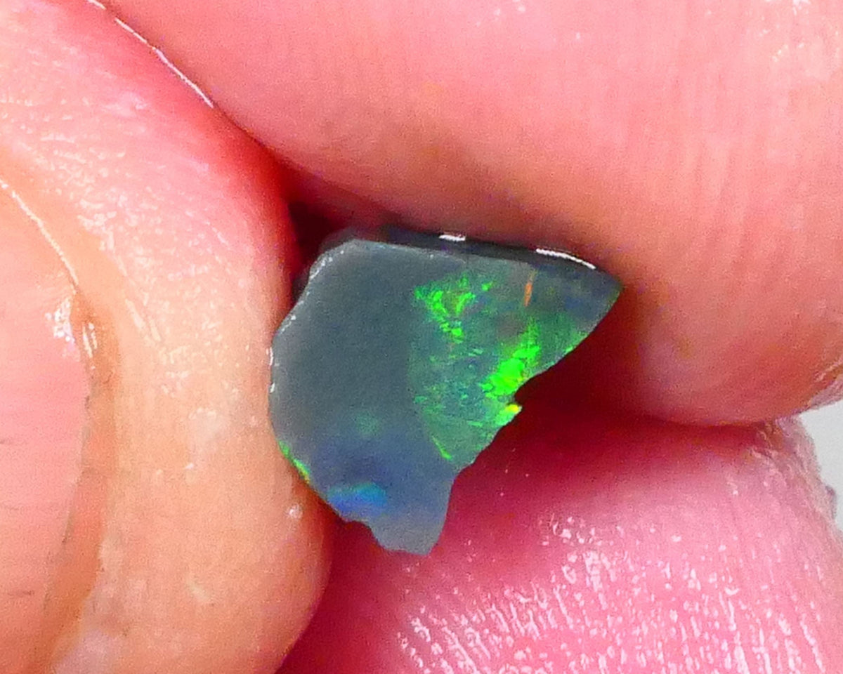 Gorgeous Broad zone of Electric Bright Green fires 1.60cts Lightning Ridge rub/rough pointer to finish 8x6x5mm   Lot B4-A736