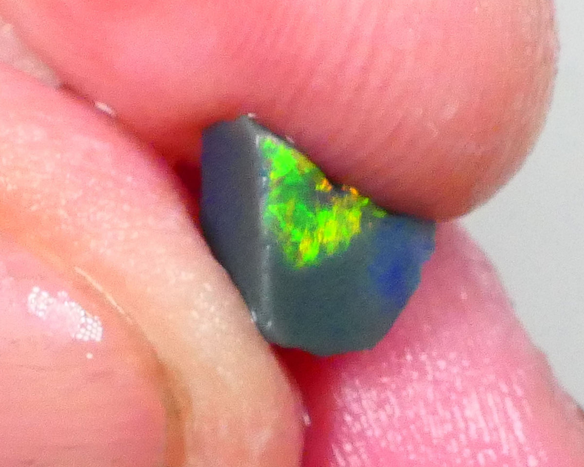Gorgeous Broad zone of Electric Bright Green fires 1.60cts Lightning Ridge rub/rough pointer to finish 8x6x5mm   Lot B4-A736
