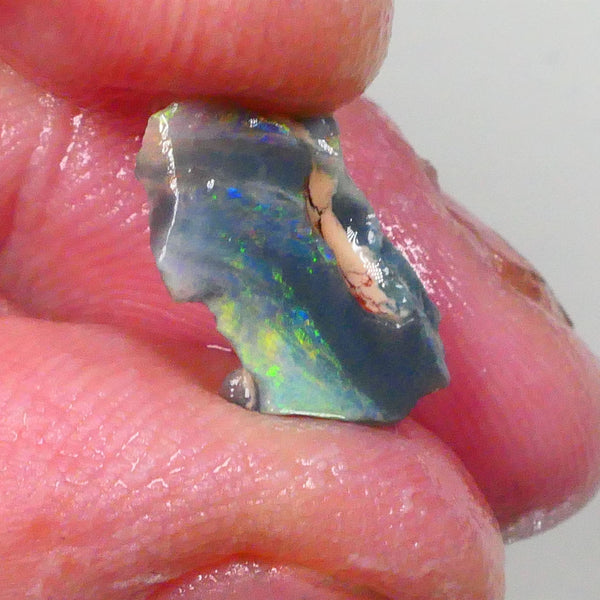 Reds & Multifires to exposed face Small bit of Bling 1.60cts Rub/rough opal of Lighting Ridge dark base to finish & polish 14x9x2mm 14x9x2mm Lot B4-A735