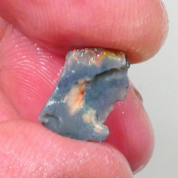 Reds & Multifires to exposed face Small bit of Bling 1.60cts Rub/rough opal of Lighting Ridge dark base to finish & polish 14x9x2mm 14x9x2mm Lot B4-A735