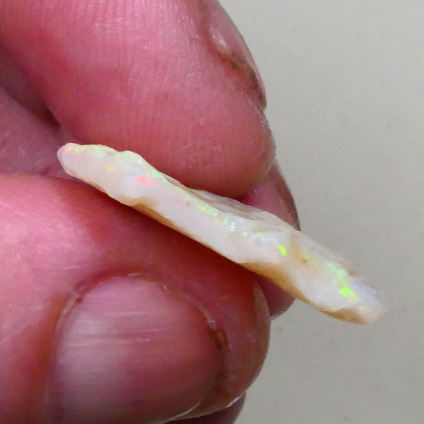 Coober Pedy seam opal rough 9.25cts Yellow dominant fires to chase & cut 25x19x4mm Lot B4-A796