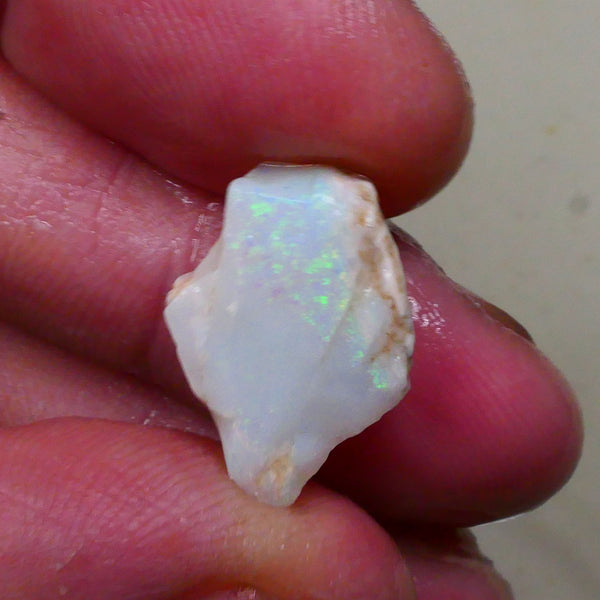 Light base Seam opal rough / rub 7.40cts Green / Blue fires to exposed face 19x12x6mm  Lot B4-A795
