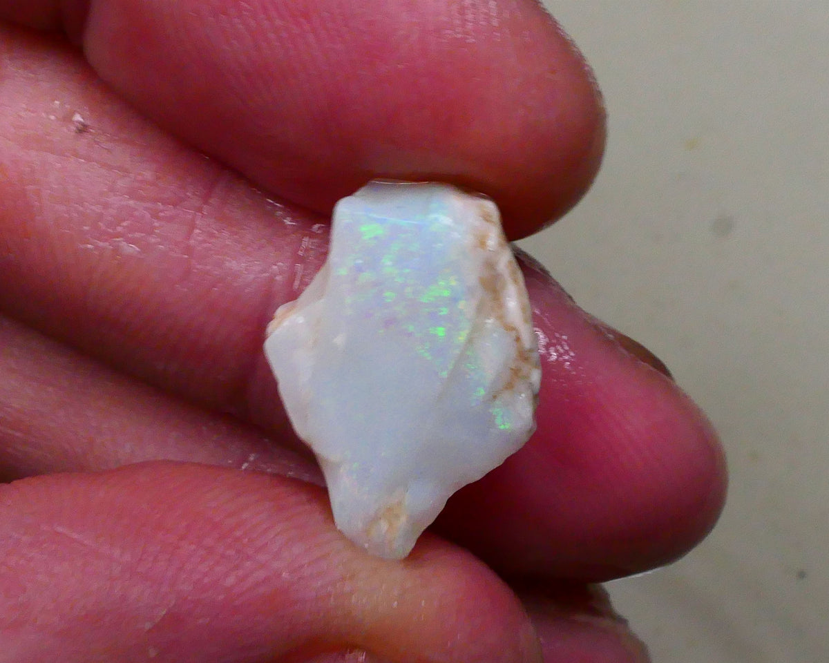 Light base Seam opal rough / rub 7.40cts Green / Blue fires to exposed face 19x12x6mm  Lot B4-A795