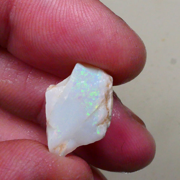 Light base Seam opal rough / rub 7.40cts Green / Blue fires to exposed face 19x12x6mm  Lot B4-A795