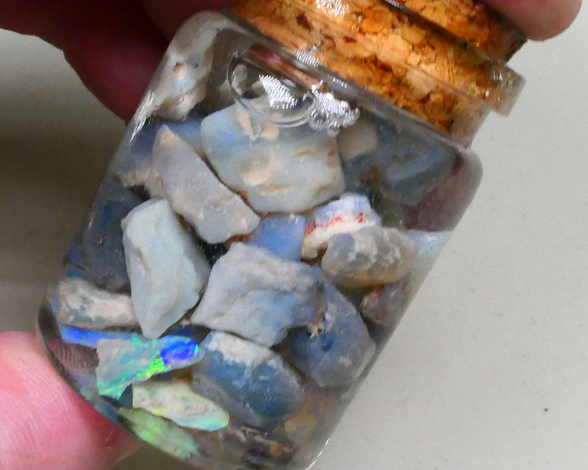 Lighting Ridge Potch & some nice colours 145.00cts Dark base seam & knobby material 15mm to chip size Lot B4-A794
